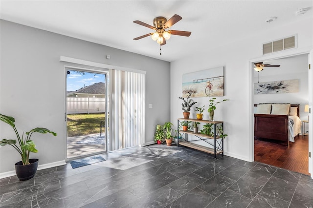 interior space featuring visible vents, baseboards, marble finish floor, and a ceiling fan