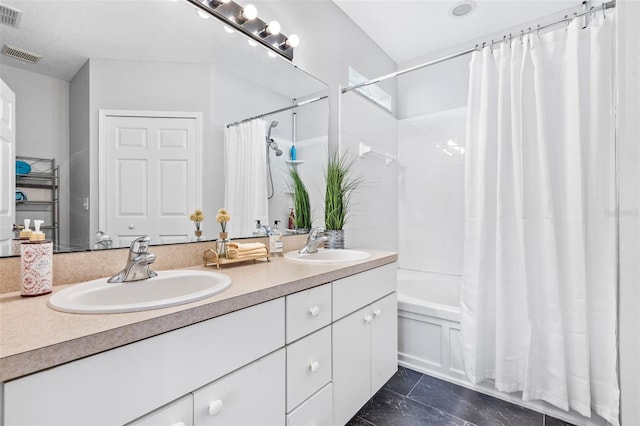 full bathroom featuring visible vents, shower / tub combo with curtain, and a sink