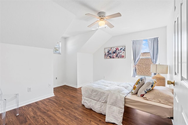 bedroom featuring vaulted ceiling, ceiling fan, baseboards, and wood finished floors