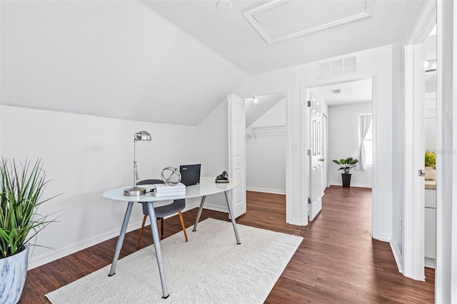 home office with baseboards, visible vents, dark wood finished floors, lofted ceiling, and attic access