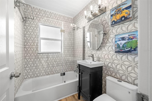 full bathroom featuring vanity, toilet, shower / tub combination, and wood finished floors