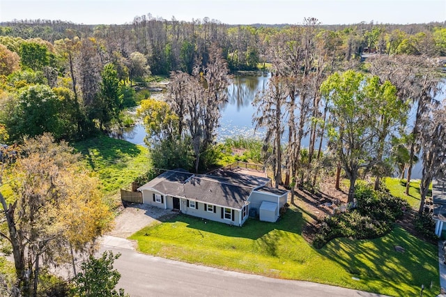 aerial view featuring a water view and a wooded view