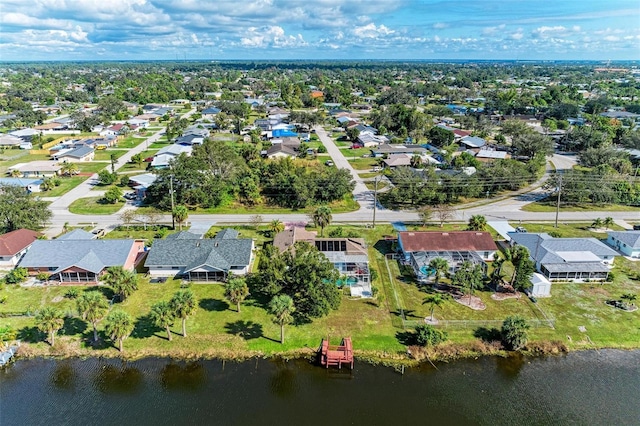 birds eye view of property with a residential view and a water view