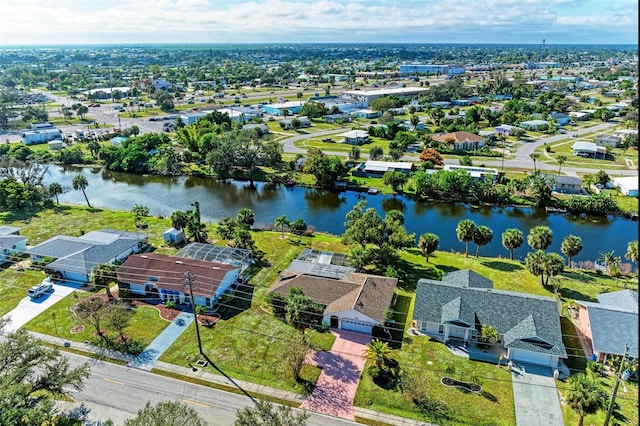 bird's eye view with a residential view and a water view