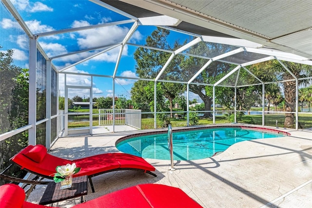 pool featuring a lanai and a patio area