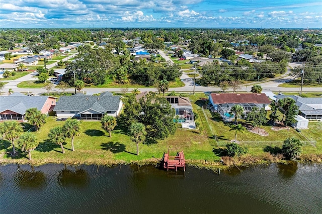 aerial view with a residential view and a water view