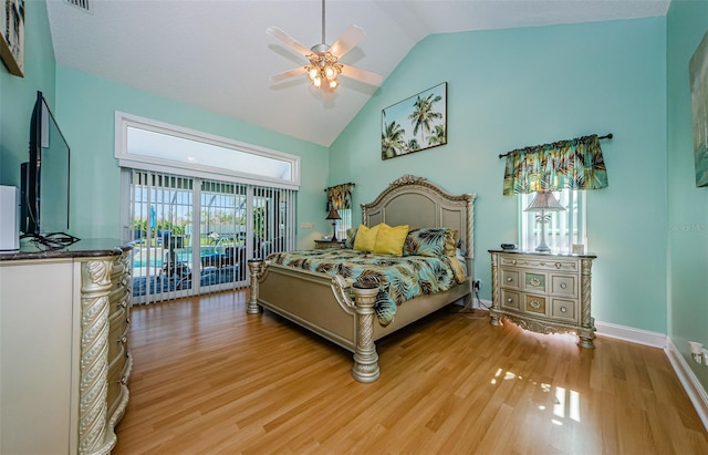 bedroom with high vaulted ceiling, light wood-style flooring, a ceiling fan, baseboards, and access to exterior