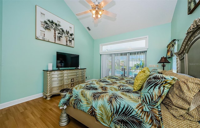 bedroom featuring visible vents, a ceiling fan, wood finished floors, baseboards, and access to exterior