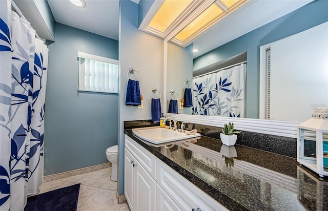 bathroom with tile patterned floors, baseboards, toilet, and vanity