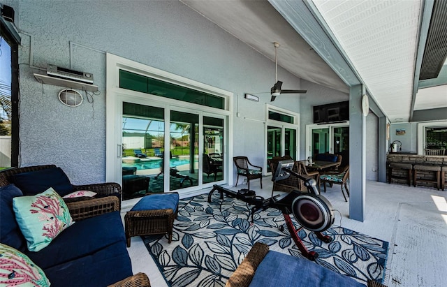 view of patio with ceiling fan and outdoor lounge area