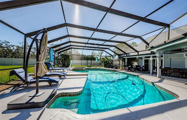 view of pool featuring fence, a fenced in pool, an in ground hot tub, a lanai, and a patio area