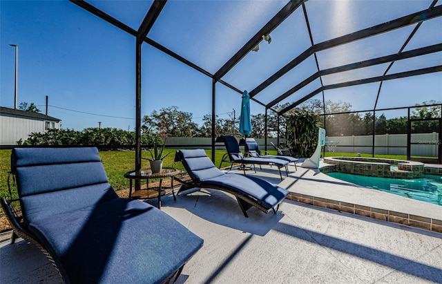 view of patio featuring a pool with connected hot tub, a lanai, and fence