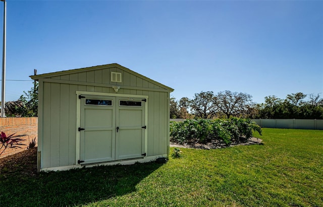 view of shed with a fenced backyard