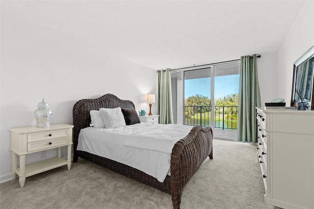 bedroom with baseboards, light colored carpet, floor to ceiling windows, and access to outside