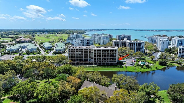 aerial view featuring a city view and a water view