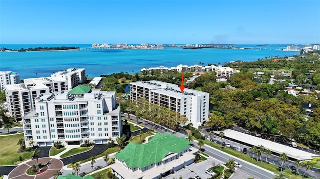 aerial view featuring a city view and a water view