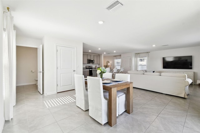 dining room featuring recessed lighting, visible vents, baseboards, and light tile patterned floors