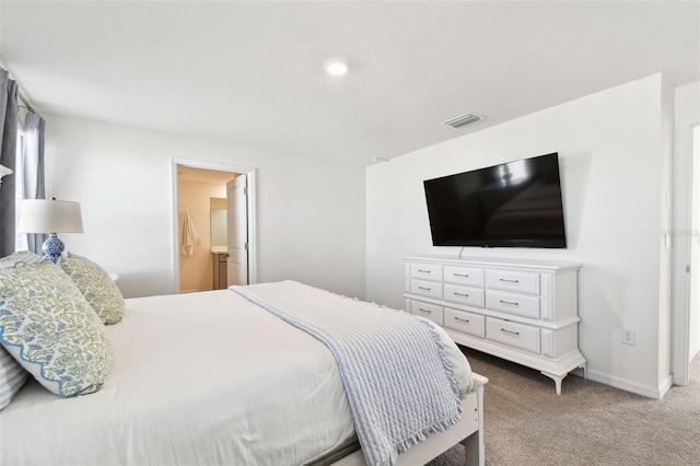 bedroom with baseboards, visible vents, and carpet floors