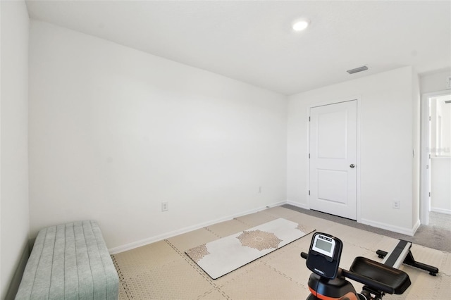 exercise area with visible vents and baseboards