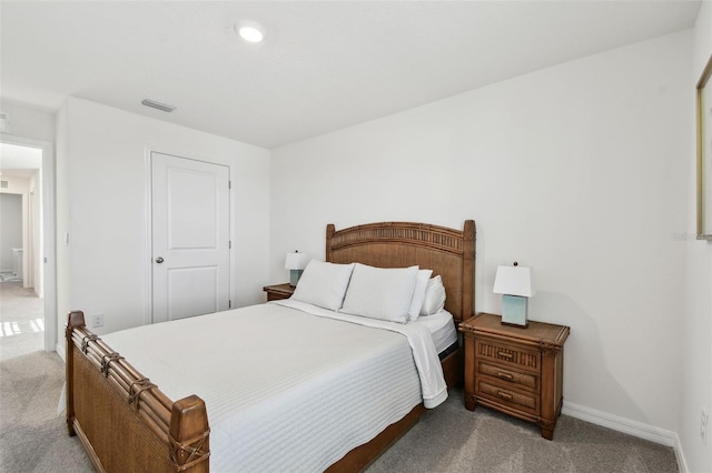 bedroom featuring visible vents, carpet floors, and baseboards