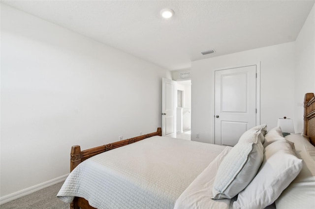 bedroom with visible vents, baseboards, and carpet floors