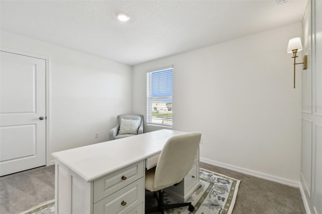 carpeted office with baseboards