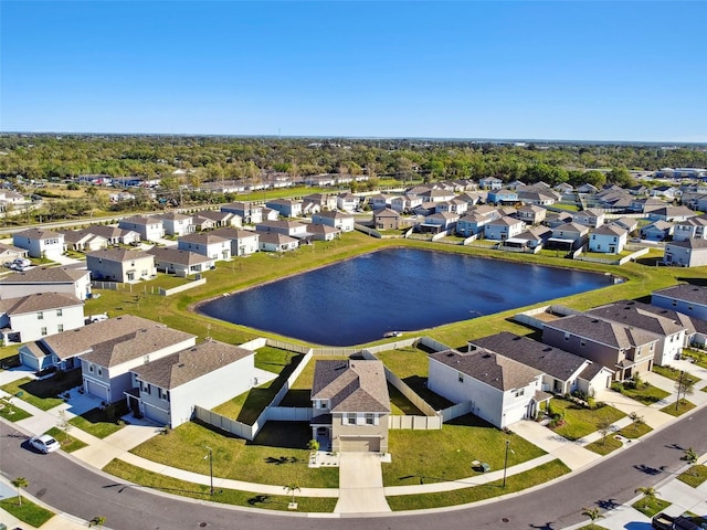 bird's eye view with a residential view and a water view