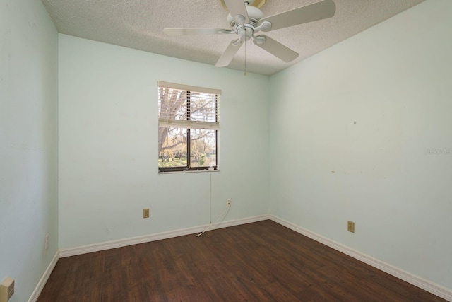 unfurnished room featuring a textured ceiling, a ceiling fan, baseboards, and dark wood-style flooring