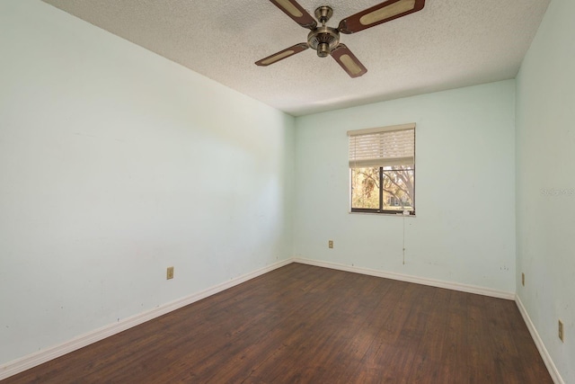 spare room featuring baseboards, wood-type flooring, a textured ceiling, and ceiling fan