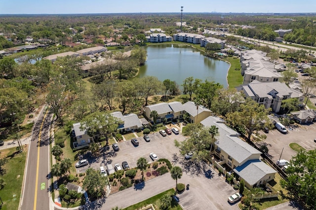 birds eye view of property with a water view and a residential view