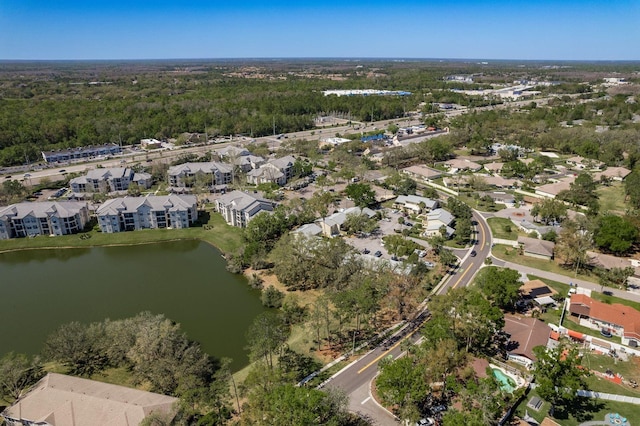 birds eye view of property with a water view and a residential view