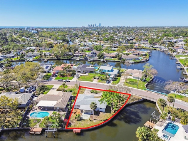 aerial view featuring a residential view and a water view