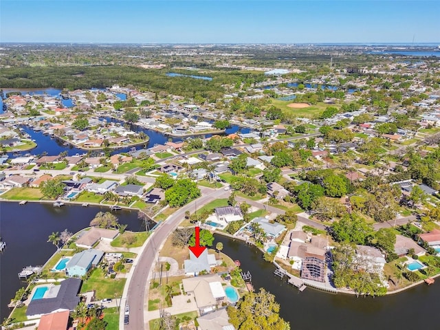 drone / aerial view with a residential view and a water view