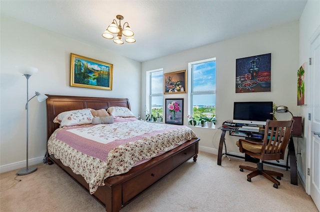 bedroom with a notable chandelier, light colored carpet, and baseboards