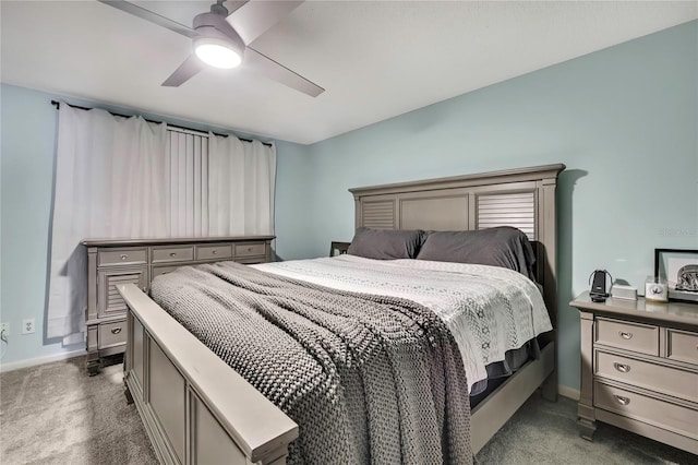 bedroom with baseboards, carpet floors, and a ceiling fan