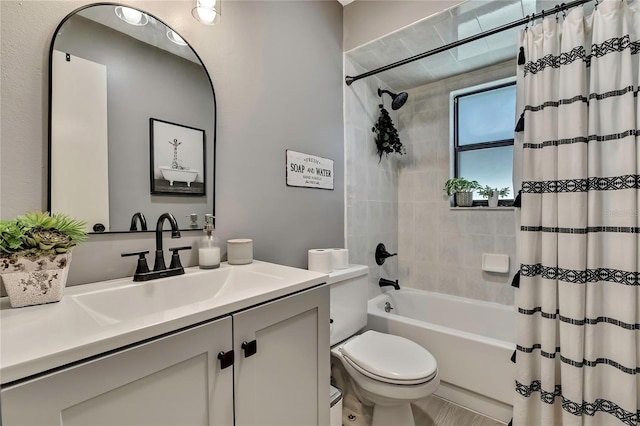 bathroom with vanity, toilet, and shower / bathtub combination with curtain