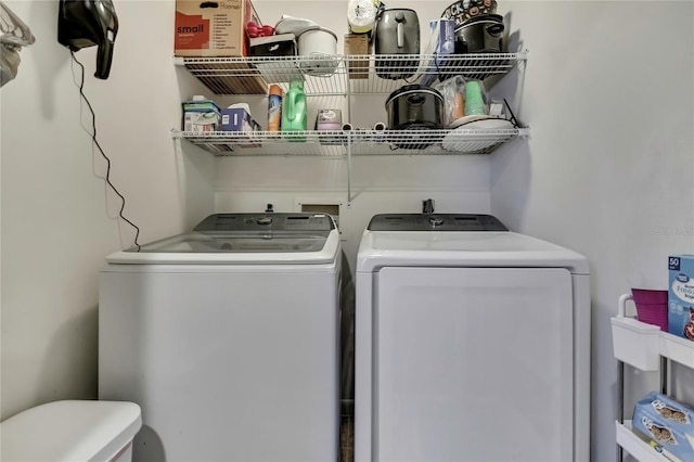 washroom featuring independent washer and dryer and laundry area