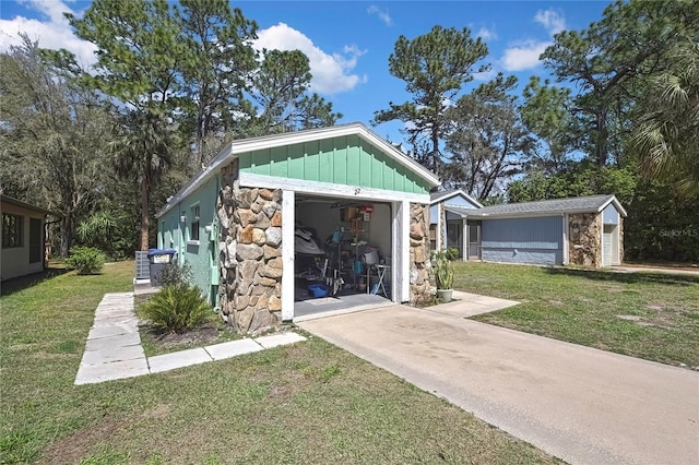 view of outbuilding featuring an attached garage and driveway