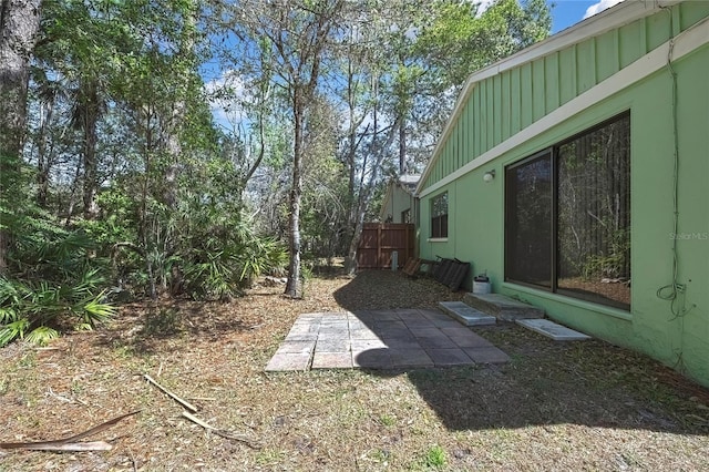 view of yard featuring a patio and fence