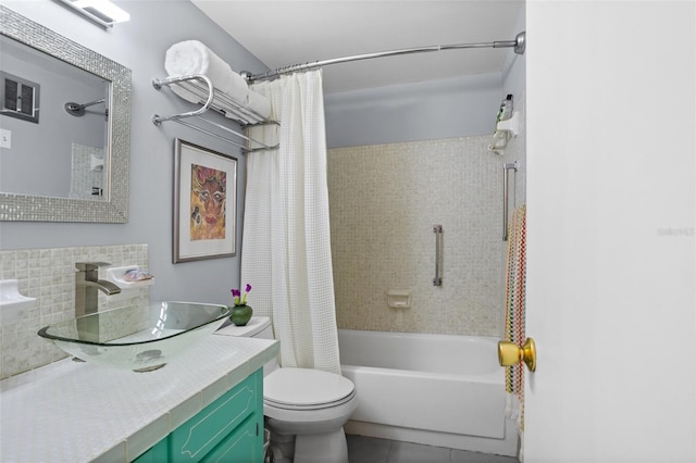 full bathroom featuring vanity, visible vents, shower / bath combo with shower curtain, tile patterned floors, and toilet