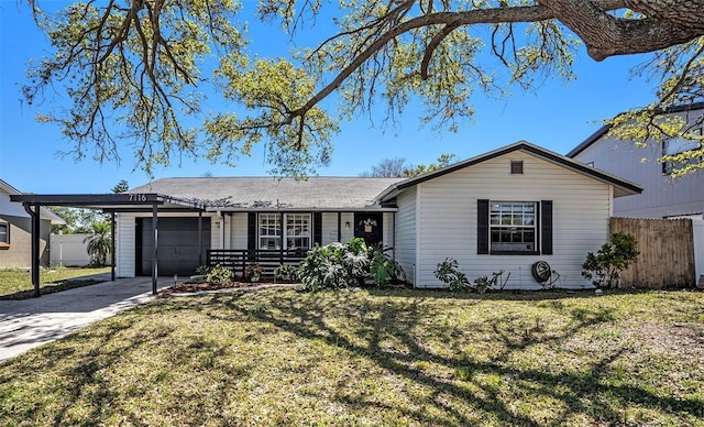 single story home with a front lawn, an attached garage, fence, and driveway