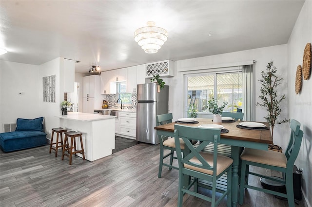 dining space with dark wood-style floors and visible vents