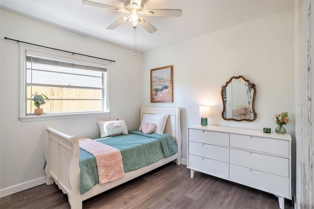 bedroom featuring ceiling fan, baseboards, and dark wood-style floors