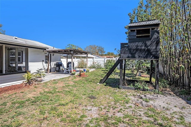 view of yard with a patio area, a pergola, and a fenced backyard