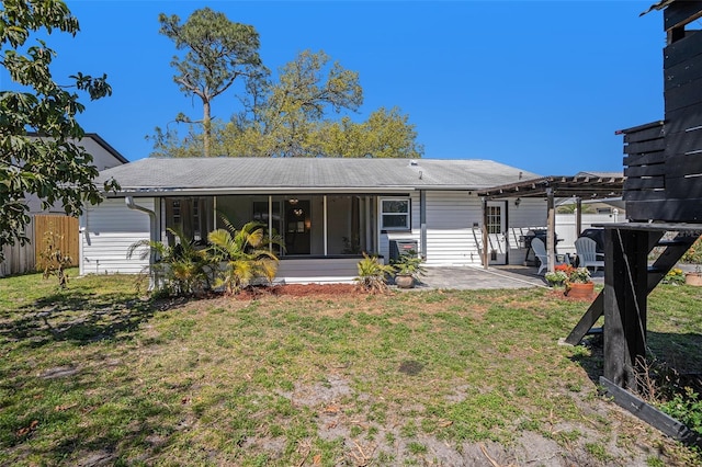 back of house with a patio, fence, a pergola, a sunroom, and a lawn