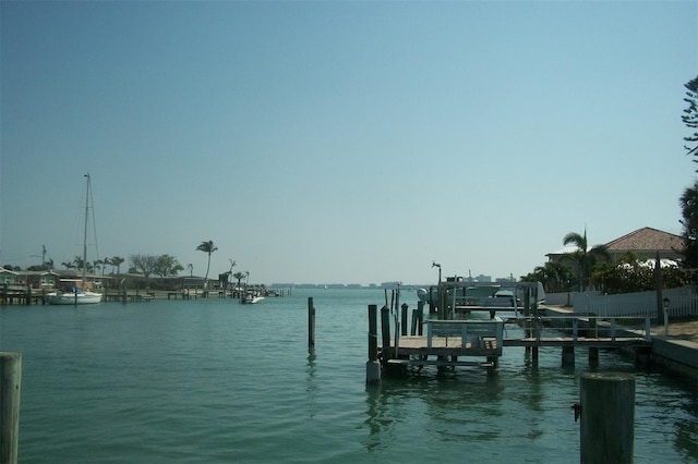 view of dock featuring a water view and boat lift