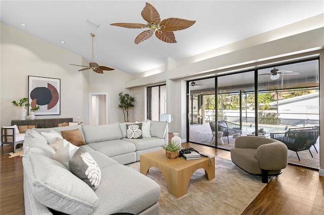 living room with high vaulted ceiling, ceiling fan, and wood finished floors