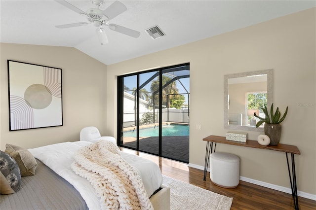 bedroom featuring visible vents, lofted ceiling, multiple windows, and access to exterior