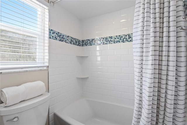 bathroom with toilet and shower / bath combo with shower curtain