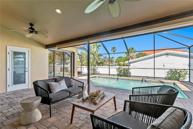 view of swimming pool featuring glass enclosure, a patio, a fenced in pool, and outdoor lounge area